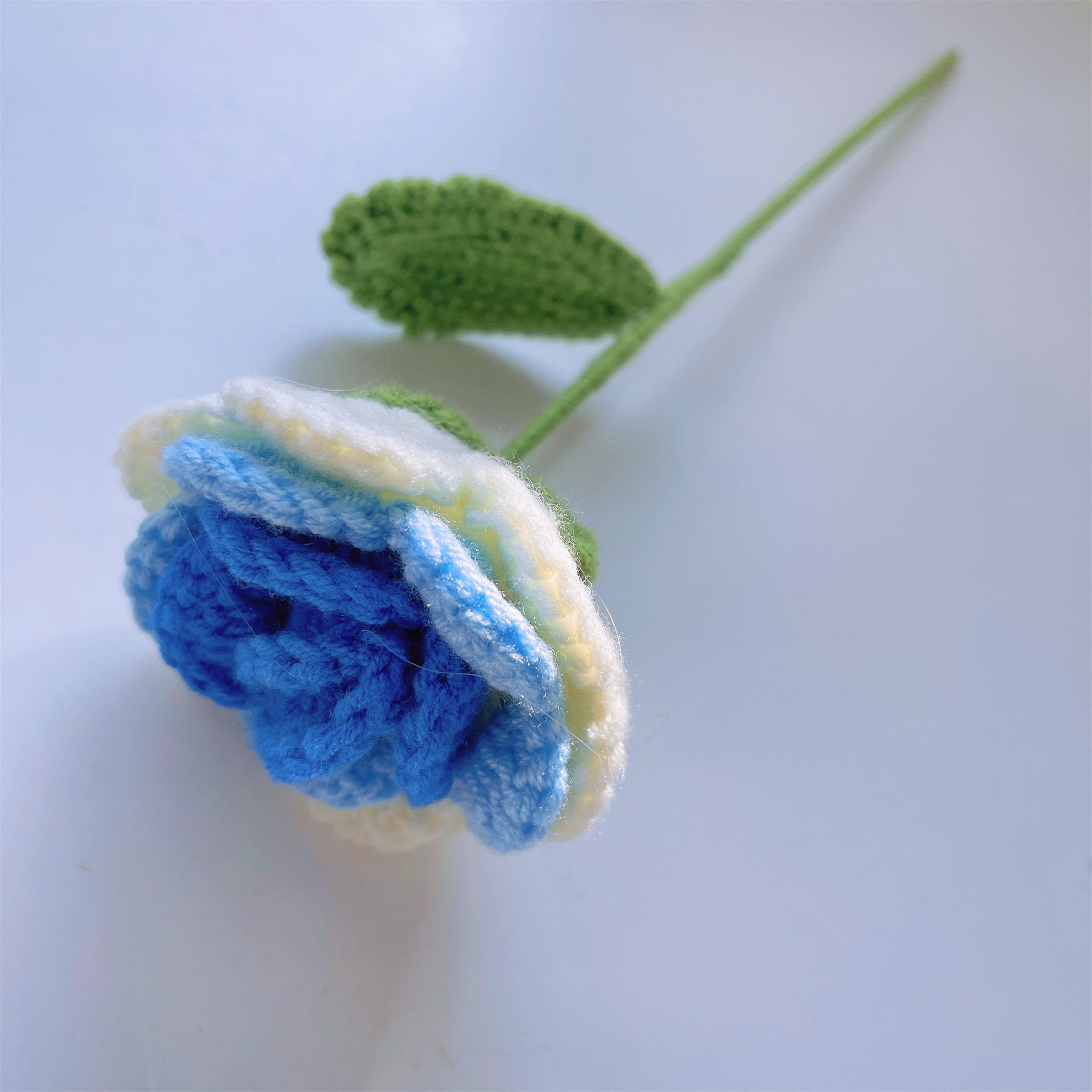 Frozen White-to-Blue Gradient Roses Bouquet with White Baby's Breath and Vibrant Colorful Butterfly Accents, Beautifully Wrapped in Light and Dark Blue Papers, Ideal for Princess-like Celebrations