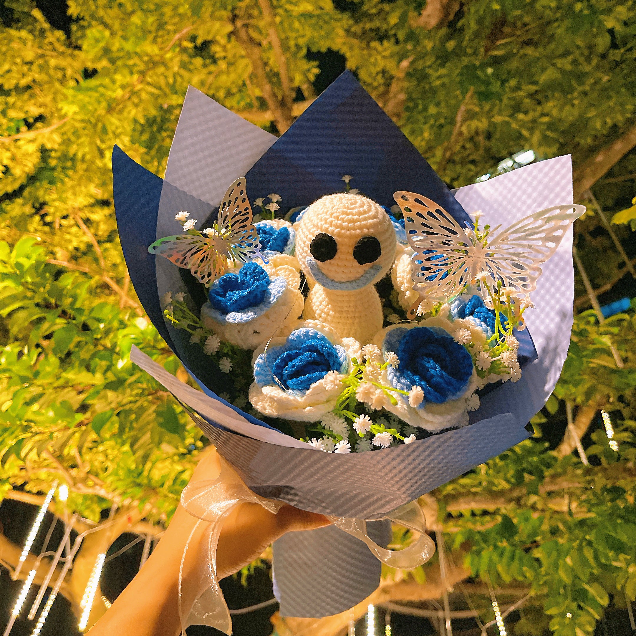 Frozen White-to-Blue Gradient Roses Bouquet with White Baby's Breath and Vibrant Colorful Butterfly Accents, Beautifully Wrapped in Light and Dark Blue Papers, Ideal for Princess-like Celebrations
