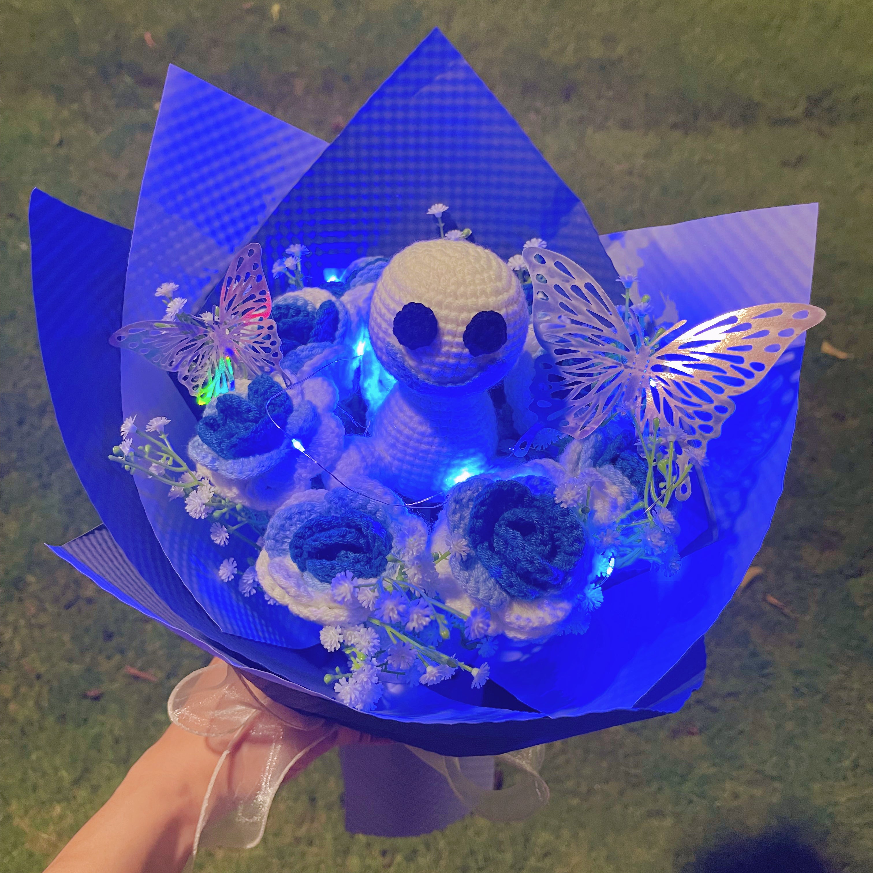 Frozen White-to-Blue Gradient Roses Bouquet with White Baby's Breath and Vibrant Colorful Butterfly Accents, Beautifully Wrapped in Light and Dark Blue Papers, Ideal for Princess-like Celebrations