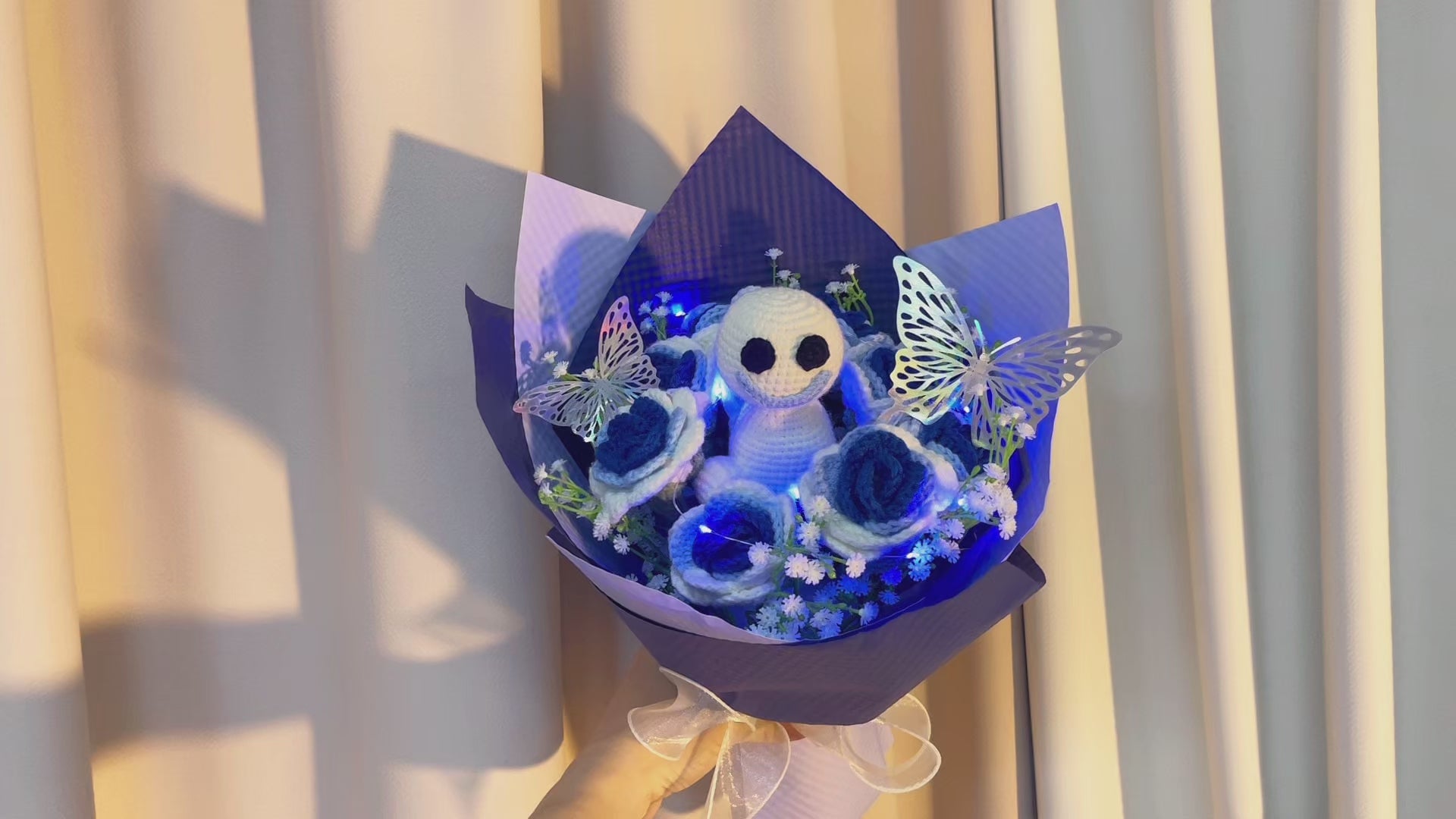 Frozen White-to-Blue Gradient Roses Bouquet with White Baby's Breath and Vibrant Colorful Butterfly Accents, Beautifully Wrapped in Light and Dark Blue Papers, Ideal for Princess-like Celebrations